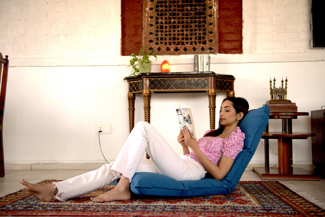 Floor chair reading in living room